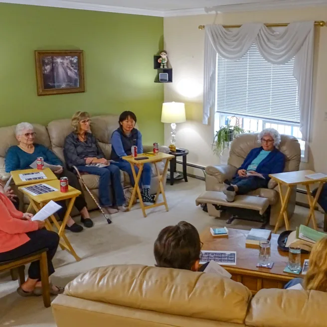 Group of seniors sitting in a circle studying the Bible